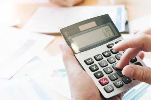 Hand using calculating focus, Professional business team investor and financi Stock Photos