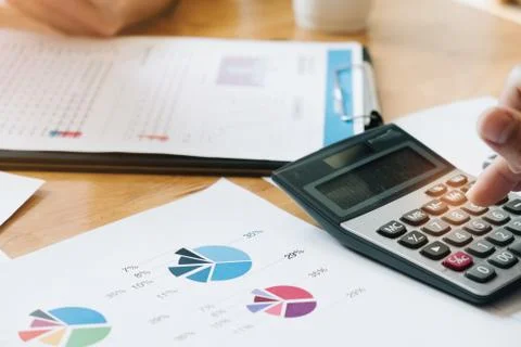 Hand using calculating focus, Professional business team investor and financi Stock Photos