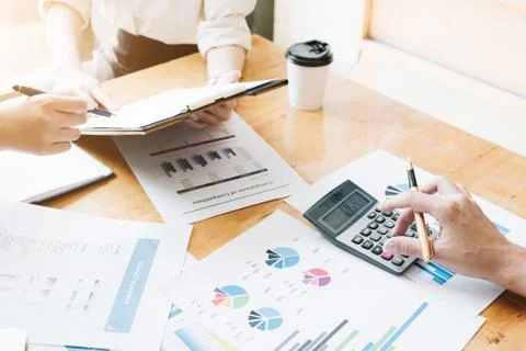 Hand using calculating focus, Professional business team investor and financi Stock Photos