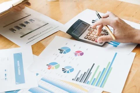 Hand using calculating focus, Professional business team investor and financi Stock Photos