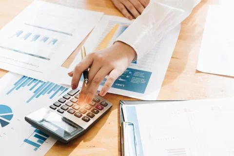 Hand using calculating focus, Professional business team investor and financi Stock Photos