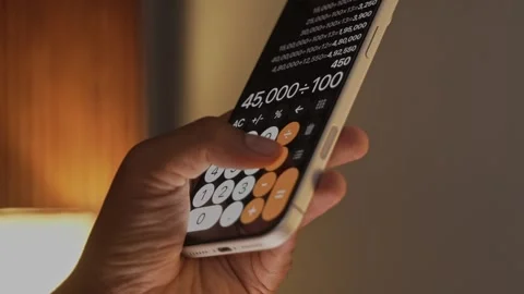 Hand Using Calculator App on Smartphone for Calculation. Stock Footage 340966369