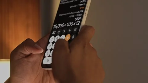 Hand Using Calculator App on Smartphone for Calculation. Stock Footage 340966400