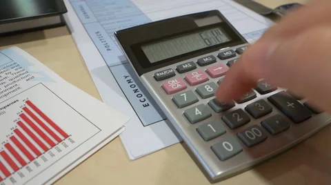 A hand using calculator in the office Video stock 56305297
