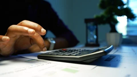 Hand Using Calculator on Office Paperwork, Close-up of a person using a cal.. Vídeos de archivo 346462465