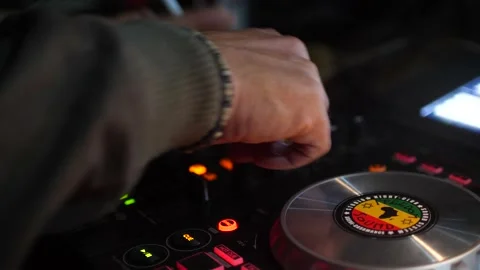 Hand using CD mixing console adjusting sliders Stock Footage 208940931