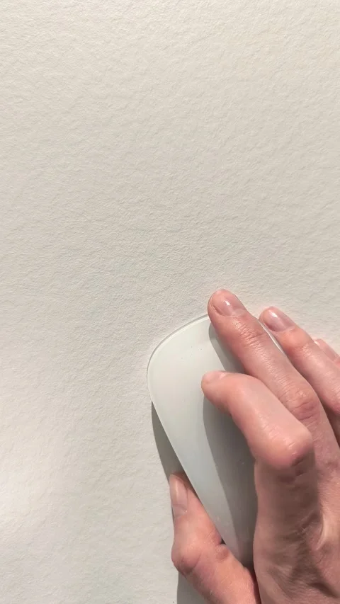 Hand using computer mouse on a clean white desk with ample negative copy sp.. Stock Footage 345552853