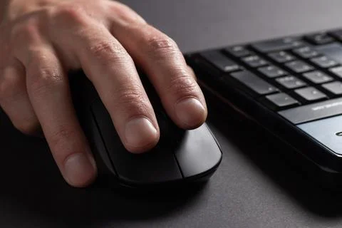 Hand using computer mouse, clicking pointer pc peripheral, close up Stock Photos