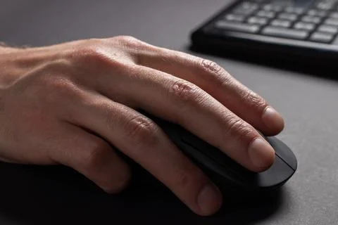 Hand using computer mouse, clicking pointer pc peripheral, close up Stock Photos