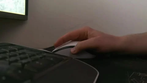 Hand using computer mouse at desk, modern workspace scene, technology and produc Stock Footage 334603399