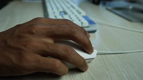 Hand Using Computer Mouse at Desk, Close-up of a person's hand using a comp.. Stock Footage 345119189