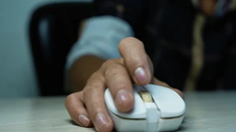 Hand Using a Computer Mouse on Desk, Close-up of a person's hand using a wh.. Stock Footage 345119519