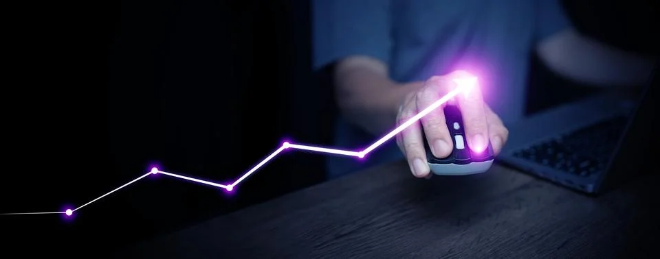 Hand using computer mouse with glowing purple rising arrow graph, symbolizi.. Stock Photos