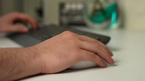 Hand using computer mouse with keyboard on desk Stock Footage 316233679