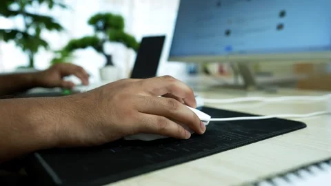 Hand Using Computer Mouse in Office Setting, Close-up of a hand using a com.. Stock Footage 317737146