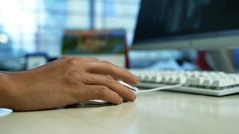 Hand Using Computer Mouse at Office Desk, Close-up of a person's hand using.. 動画素材 345119895