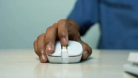 Hand using a computer mouse on office desk, Close-up of a person using a co.. Video stock 346484017