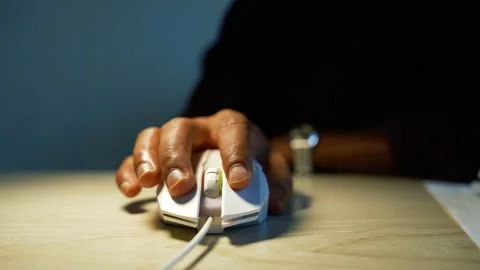 Hand Using Computer Mouse on Wooden Desk, Close-up of a person's hand using.. Stock-Footage 346462629