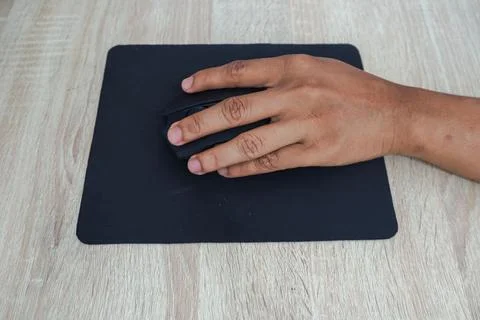 Hand Using Computer Mouse On Wooden Desk Stock Photos