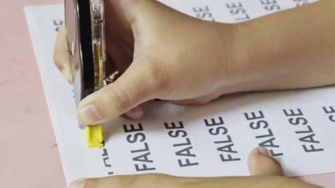 Hand using correction tape to cover false text on paper Видео 347514675