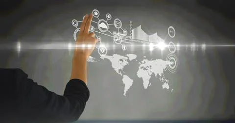 Hand using digital interface screen with network of icons, world map and chart Stock Photos