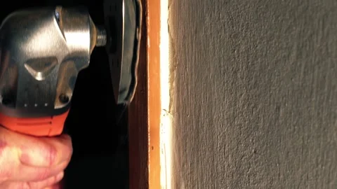 Hand using a electric power sanding machine on old door Stock Footage 245374987