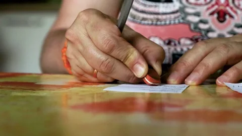 Hand using eraser to correct handwritten notes on small paper cards Stock Footage 340917257