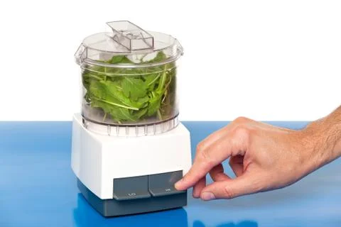 Hand using a food processor Stock Photos