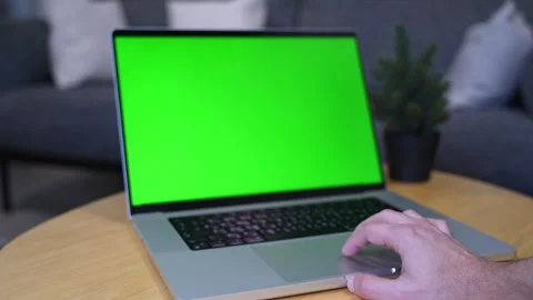 Hand Using Green Screen Laptop On Wooden Table Stock Footage 337440867