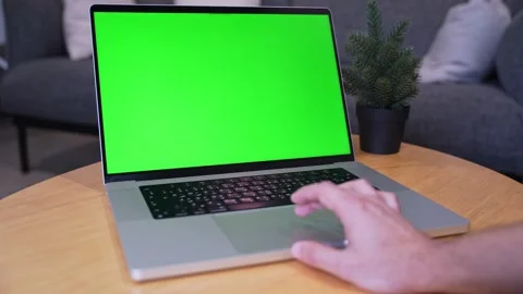 Hand using green screen laptop indoors Stock Footage 341716730