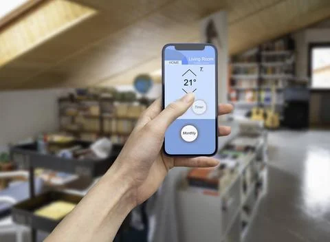 Hand using home automation app for home smart technology Hand holding a mo... Stock Photos