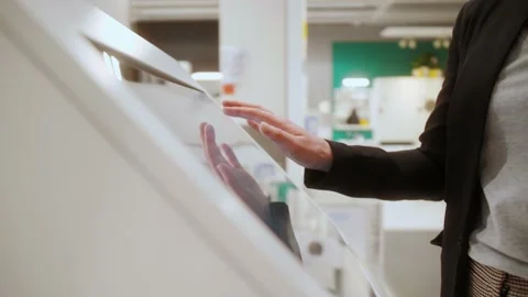 Hand using interactive touchscreen display of electronic multimedia terminal. Stock Footage 145413739