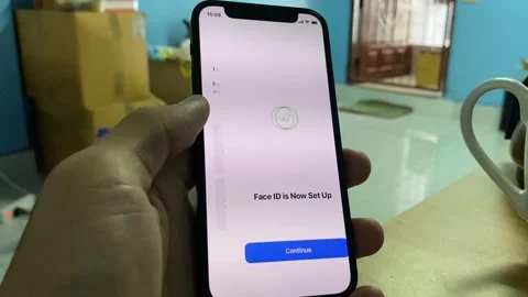 Hand using iphone 12 mini scrolling and tapping "Use Face ID with a Mask" Video stock 243092812