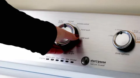 Hand using the knobs and button of the electric clothes washing machine. 스톡 동영상 170919052