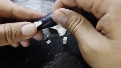 Hand using lancet device and test strip for blood glucose measurement Stock Footage 334295755