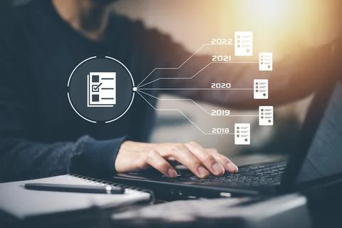 Hand using laptop and touch folder of document Management System, online docu Foto stock
