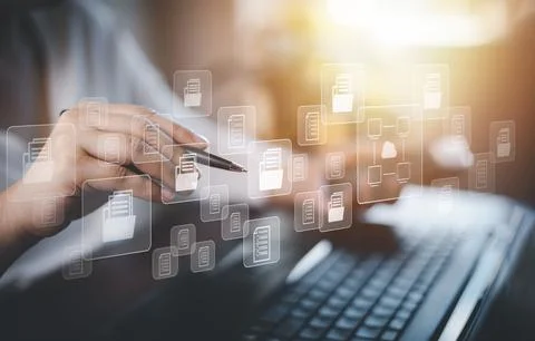 Hand using laptop and touch folder of document Management System, online docu Stock Photos