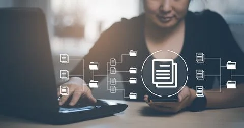 Hand using laptop and touch folder of document Management System, online docu Stock Photos
