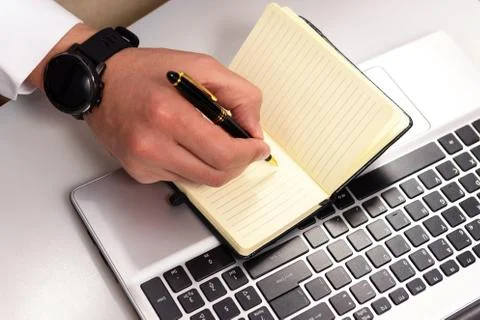 Hand using laptop and write note inspire idea on office desk Stock Photos