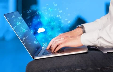 Hand using laptop with centralized cloud computing system concept Stock Photos