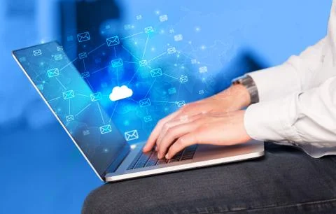 Hand using laptop with centralized cloud computing system concept Stock Photos