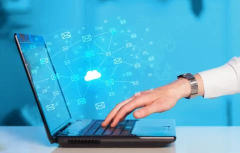 Hand using laptop with centralized cloud computing system concept Stock Photos
