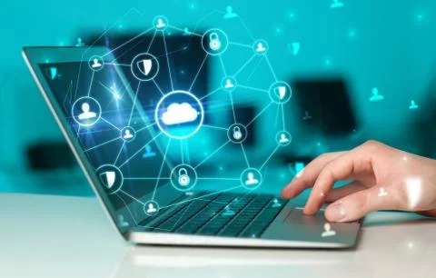 Hand using laptop with centralized linked cloud system concept Stock Photos