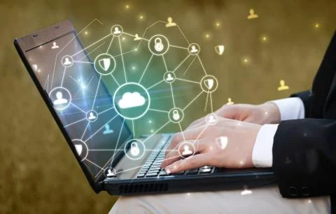 Hand using laptop with centralized linked cloud system concept Stock Photos