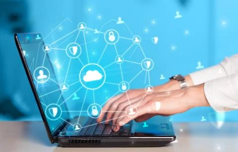 Hand using laptop with centralized linked cloud system concept Stock Photos