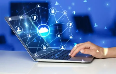 Hand using laptop with centralized linked cloud system concept Stock Photos