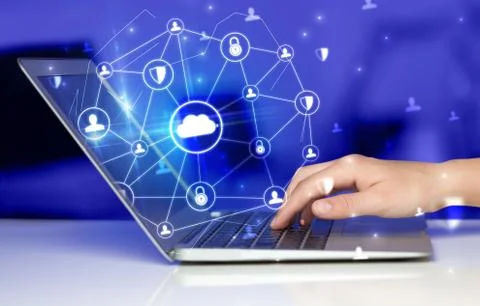 Hand using laptop with centralized linked cloud system concept Stock Photos