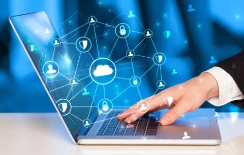 Hand using laptop with centralized linked cloud system concept Stock Photos