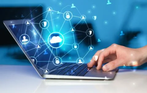 Hand using laptop with centralized linked cloud system concept Stock Photos