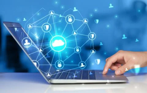 Hand using laptop with centralized linked cloud system concept Stock Photos